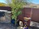 Tranquil backyard featuring lush greenery, a birdbath, and an outdoor grilling area at 10398 Addie De Mar Ln, Las Vegas, NV 89135