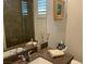Stylish bathroom featuring a shower with stone walls, a modern sink, and elegant decor at 10398 Addie De Mar Ln, Las Vegas, NV 89135