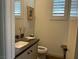 Well-lit bathroom featuring a vanity with a white sink and classic design elements at 10398 Addie De Mar Ln, Las Vegas, NV 89135