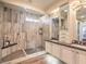 Luxurious bathroom featuring a spacious walk-in shower, double sinks, and elegant design at 10398 Addie De Mar Ln, Las Vegas, NV 89135