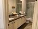 Contemporary bathroom featuring double vanity, neutral finishes, and framed mirrors at 10398 Addie De Mar Ln, Las Vegas, NV 89135