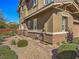 Inviting home with brick accents, stone landscaping, and a pathway leading to the entrance at 10398 Addie De Mar Ln, Las Vegas, NV 89135
