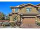 Charming two-story home with a two-car garage, neat landscaping, and a classic architectural design at 10398 Addie De Mar Ln, Las Vegas, NV 89135