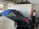 Organized garage with two cars, storage cabinets, and a water filtration system at 10398 Addie De Mar Ln, Las Vegas, NV 89135