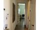 Hallway view of a modern home, offering a glimpse into a well-lit bonus room at 10398 Addie De Mar Ln, Las Vegas, NV 89135