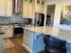 Stylish kitchen with marble island, sleek countertops, stainless steel appliances, and elegant backsplash at 10398 Addie De Mar Ln, Las Vegas, NV 89135