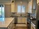 Well-lit kitchen featuring stainless steel appliances, ample counter space, and modern cabinetry at 10398 Addie De Mar Ln, Las Vegas, NV 89135