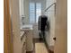Efficient laundry room with a washing machine, dryer and folding rack at 10398 Addie De Mar Ln, Las Vegas, NV 89135