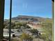 Scenic view of the neighborhood and surrounding mountains from a window at 10398 Addie De Mar Ln, Las Vegas, NV 89135