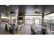 Inviting outdoor lounge with comfortable seating, a fireplace, and views of the community, great for socializing at 10398 Addie De Mar Ln, Las Vegas, NV 89135