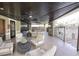 Stylish outdoor lounge area featuring cozy seating, elegant decor, and access to community amenities for relaxation at 10398 Addie De Mar Ln, Las Vegas, NV 89135