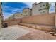 Paved area and gravel yard surrounded by brick walls in this home's backyard at 105 Campbelltown Ave, Henderson, NV 89015
