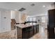 Spacious open kitchen with tile floors, center island, dark cabinets and stainless steel appliances at 105 Campbelltown Ave, Henderson, NV 89015