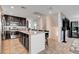 Well-lit kitchen features a large center island, dark cabinets and stainless steel appliances at 105 Campbelltown Ave, Henderson, NV 89015
