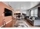 Inviting living room with a large TV, hardwood floors, and modern decor at 105 Campbelltown Ave, Henderson, NV 89015