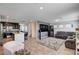 Open-concept living space with a kitchen island, modern furniture, and tile flooring at 105 Campbelltown Ave, Henderson, NV 89015