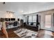 Well-lit living room with hardwood floors, modern equipment, and outdoor access at 105 Campbelltown Ave, Henderson, NV 89015