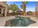 Sparkling pool with desert landscaping, mature palms, and gazebo at 10748 Aldrovandi Dr, Las Vegas, NV 89141