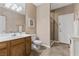 Bathroom featuring a vanity, tiled floor, a toilet and a walk-in shower with glass door at 10748 Aldrovandi Dr, Las Vegas, NV 89141