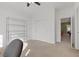 Neutral bedroom with a closet and metal shelving unit for plenty of storage at 10748 Aldrovandi Dr, Las Vegas, NV 89141