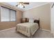 Cozy bedroom with a plush carpet, soft natural light, and a queen size bed at 10748 Aldrovandi Dr, Las Vegas, NV 89141