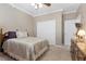 Comfortable bedroom featuring a queen-sized bed, neutral walls, and a ceiling fan at 10748 Aldrovandi Dr, Las Vegas, NV 89141