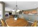 View of a spacious dining area leading to the kitchen and a cozy living room at 10748 Aldrovandi Dr, Las Vegas, NV 89141