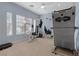 Bright exercise room with natural light and a variety of equipment at 10748 Aldrovandi Dr, Las Vegas, NV 89141