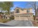 Elegant two-story home with a spacious three-car garage and a meticulously maintained front yard at 10748 Aldrovandi Dr, Las Vegas, NV 89141