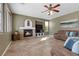 Inviting living room featuring a fireplace, ceiling fan, and neutral color palette at 10748 Aldrovandi Dr, Las Vegas, NV 89141