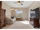 Well-lit living room with plush sofa, storage chest and modern lighting at 10748 Aldrovandi Dr, Las Vegas, NV 89141