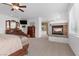 Expansive main bedroom featuring a fireplace, television and an attached bathroom at 10748 Aldrovandi Dr, Las Vegas, NV 89141