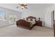 Elegant main bedroom featuring a balcony, sitting area, and abundant natural light at 10748 Aldrovandi Dr, Las Vegas, NV 89141
