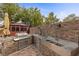 Well-equipped outdoor kitchen with stainless steel appliances and stone finishes, perfect for entertaining at 10748 Aldrovandi Dr, Las Vegas, NV 89141