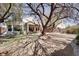 Spacious backyard features desert landscaping, covered patio, and mature shade trees at 10847 Intro Ave, Las Vegas, NV 89135