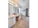Bright bathroom with double sinks, soaking tub, and a large mirror at 10847 Intro Ave, Las Vegas, NV 89135