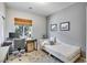 A well-lit office area with daybed and a large window at 10847 Intro Ave, Las Vegas, NV 89135