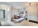 Open-concept dining room showcasing modern lighting, neutral walls and tiled and laminate flooring at 10847 Intro Ave, Las Vegas, NV 89135