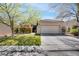 Inviting single-story home with well-manicured lawn and mature trees, providing great curb appeal at 10847 Intro Ave, Las Vegas, NV 89135