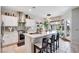 Modern kitchen with stainless steel appliances, a large island with seating, and a stylish pendant light at 10847 Intro Ave, Las Vegas, NV 89135