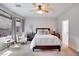 Serene bedroom with soft natural light, neutral colors, and an en-suite bathroom at 10847 Intro Ave, Las Vegas, NV 89135