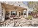 Covered patio features comfortable outdoor furniture, ceiling fan, and recessed lighting at 10847 Intro Ave, Las Vegas, NV 89135