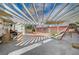 Charming backyard featuring a covered patio, built-in grill, and a fun playset for outdoor entertainment at 1113 Date St, Las Vegas, NV 89108