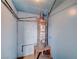 Water heater in a finished basement with blue walls and utility features at 1113 Date St, Las Vegas, NV 89108