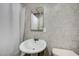Bathroom features tile flooring, toilet, pedestal sink and shower at 1113 Date St, Las Vegas, NV 89108