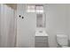 Bathroom featuring a shower/tub, sink, toilet, and small window for natural light at 1113 Date St, Las Vegas, NV 89108