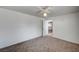 Light, bright bedroom with neutral carpet and open access to the kitchen through doorway at 1113 Date St, Las Vegas, NV 89108