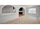 Dining room features tile flooring, modern lighting, and an arched doorway to the kitchen at 1113 Date St, Las Vegas, NV 89108