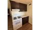 Bright kitchen features light countertops, dark cabinets, and a white gas range at 1113 Date St, Las Vegas, NV 89108