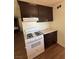 Bright kitchen features light countertops, dark cabinets, and a white gas range at 1113 Date St, Las Vegas, NV 89108